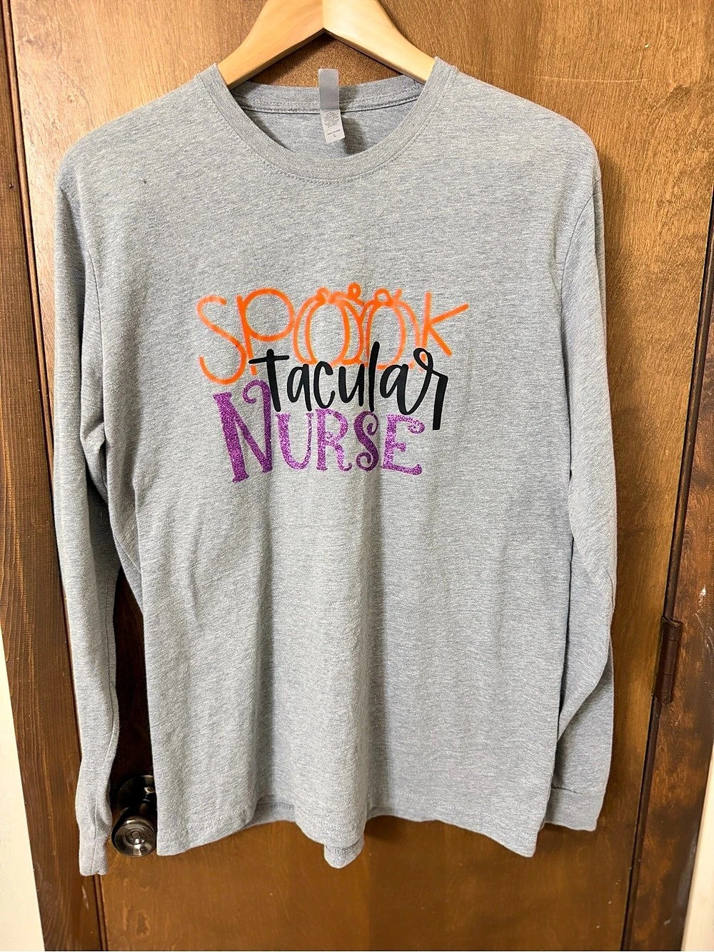 Next Level Apparel Women’s Large Spooktacular Nurse Graphic Long Sleeve Tee